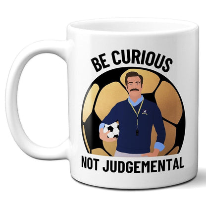 Be Curious Not Judgemental (British English Spelling) with gold football - Coffee Mug