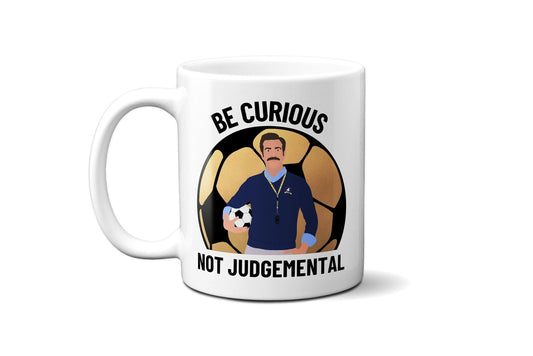 Be Curious Not Judgemental (British English Spelling) with gold football - Coffee Mug